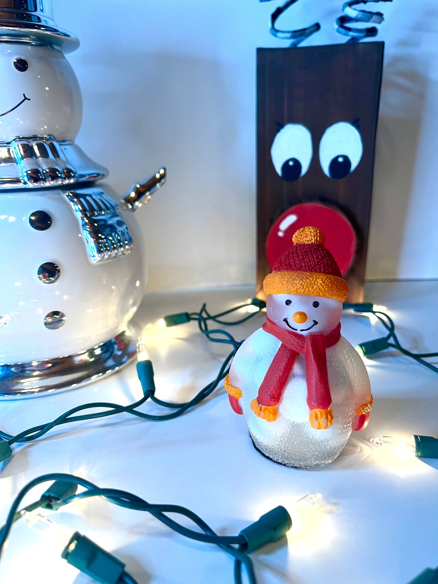 White snowman with red and orange