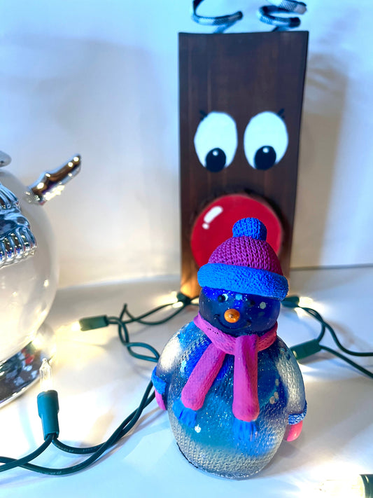 Blue glittery snowman with pink and blue