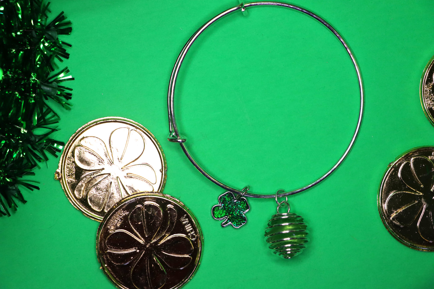 Green cage bracelet with green shamrock