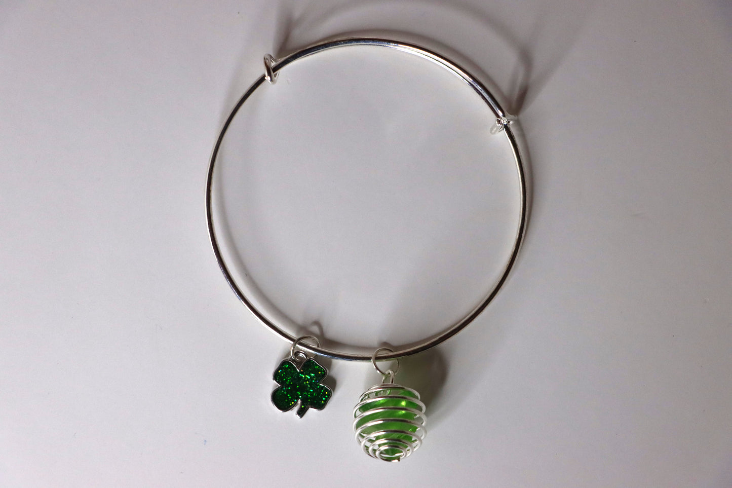 Green cage bracelet with green shamrock