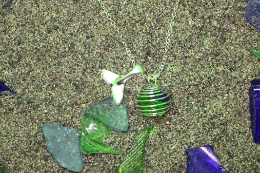 Green and blue cage necklace with whale tail